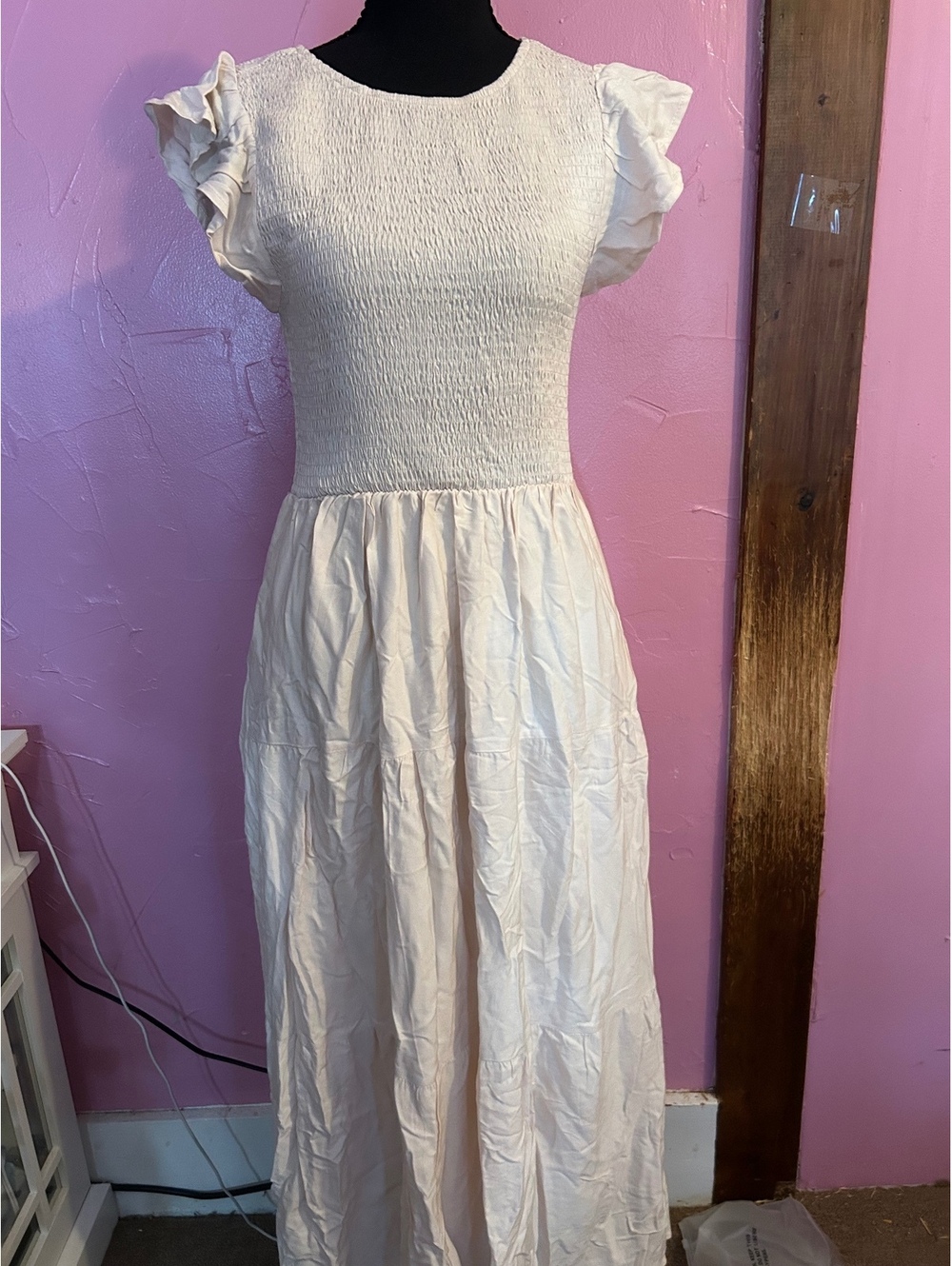 Elegant Cream Smocked Bodice Dress with Flutter Sleeves and Flowing Skirt